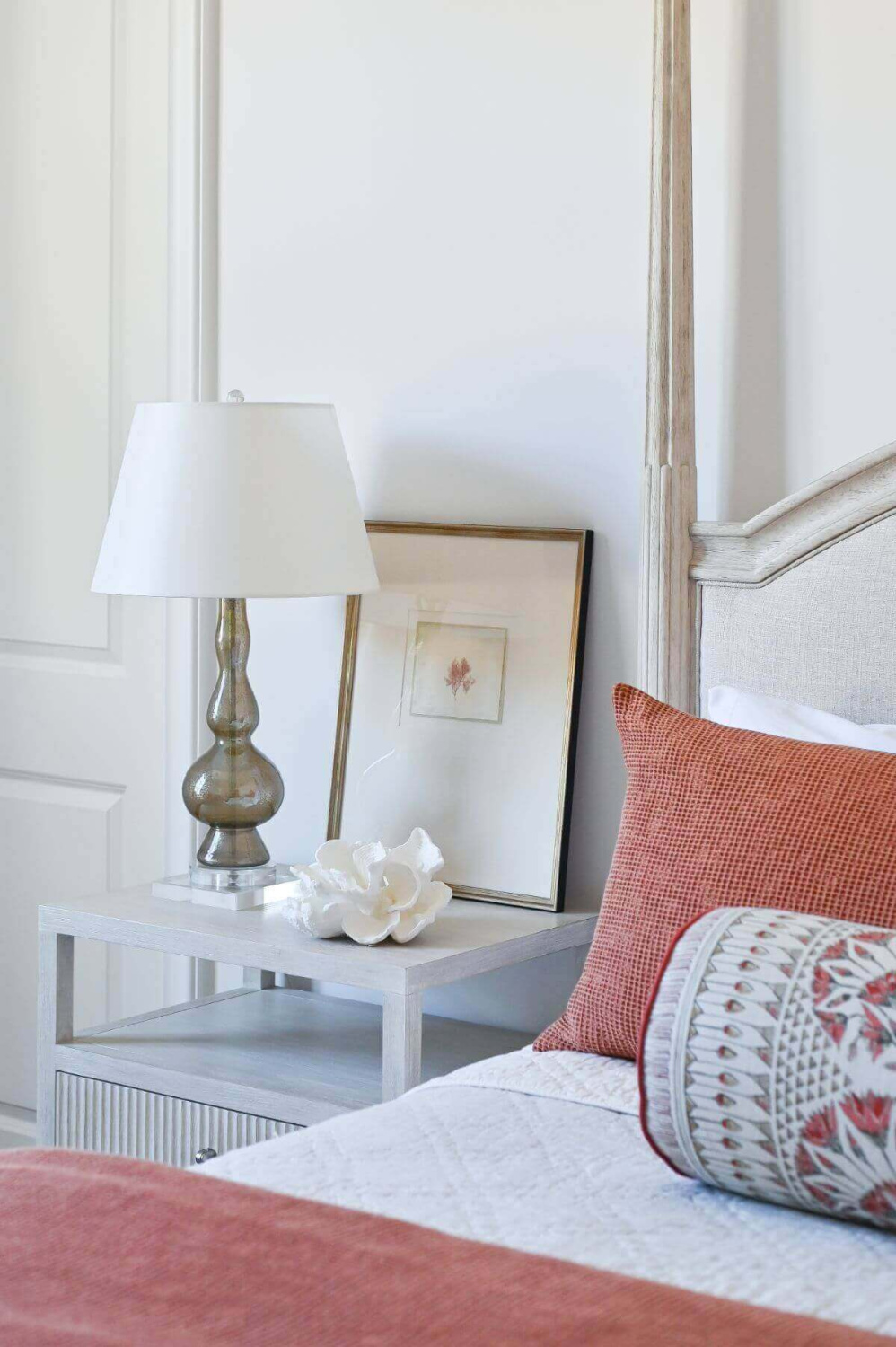 Beautiful modern French country bedroom with orange accents and pale furniture - Morningstar Builders. #frenchbedroom #modernfrench #bedroomdecor