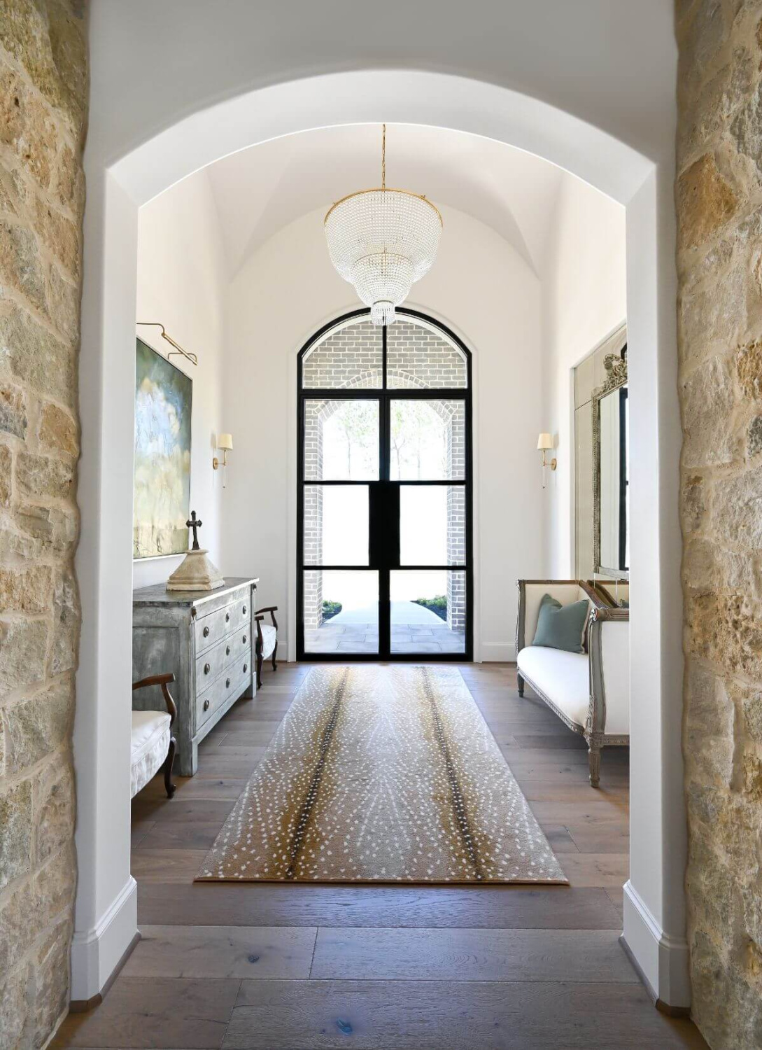 French country foyer with religious art and modern French decor - Morningstar Builders. #modernfrench #foyer #interiordesign