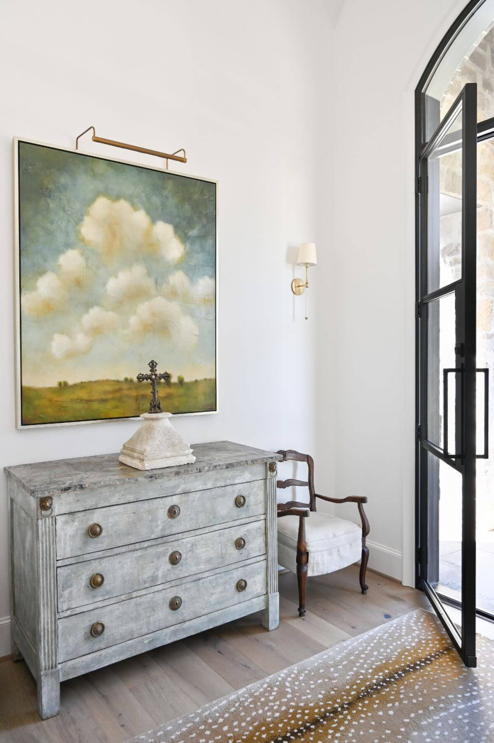 French country foyer with religious art and modern French decor - Morningstar Builders. #modernfrench #foyer #interiordesign