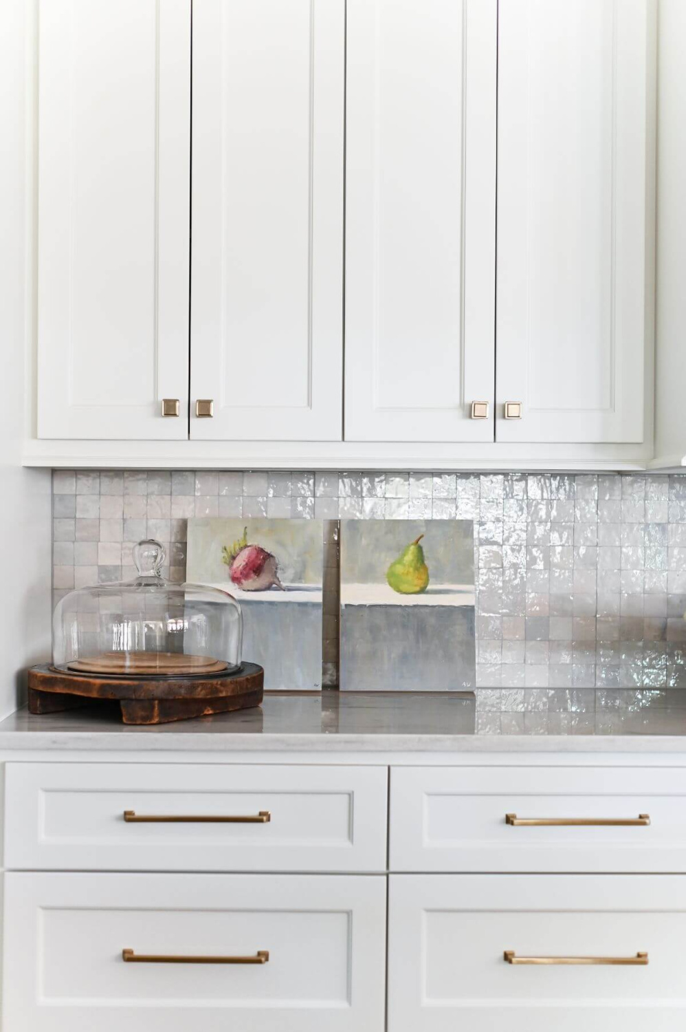 Beautiful white pantry with antiqued barn doors in a French country kitchen - Morningstar Builders. #frenchcountrypantry #frenchkitchen #pantrydesign