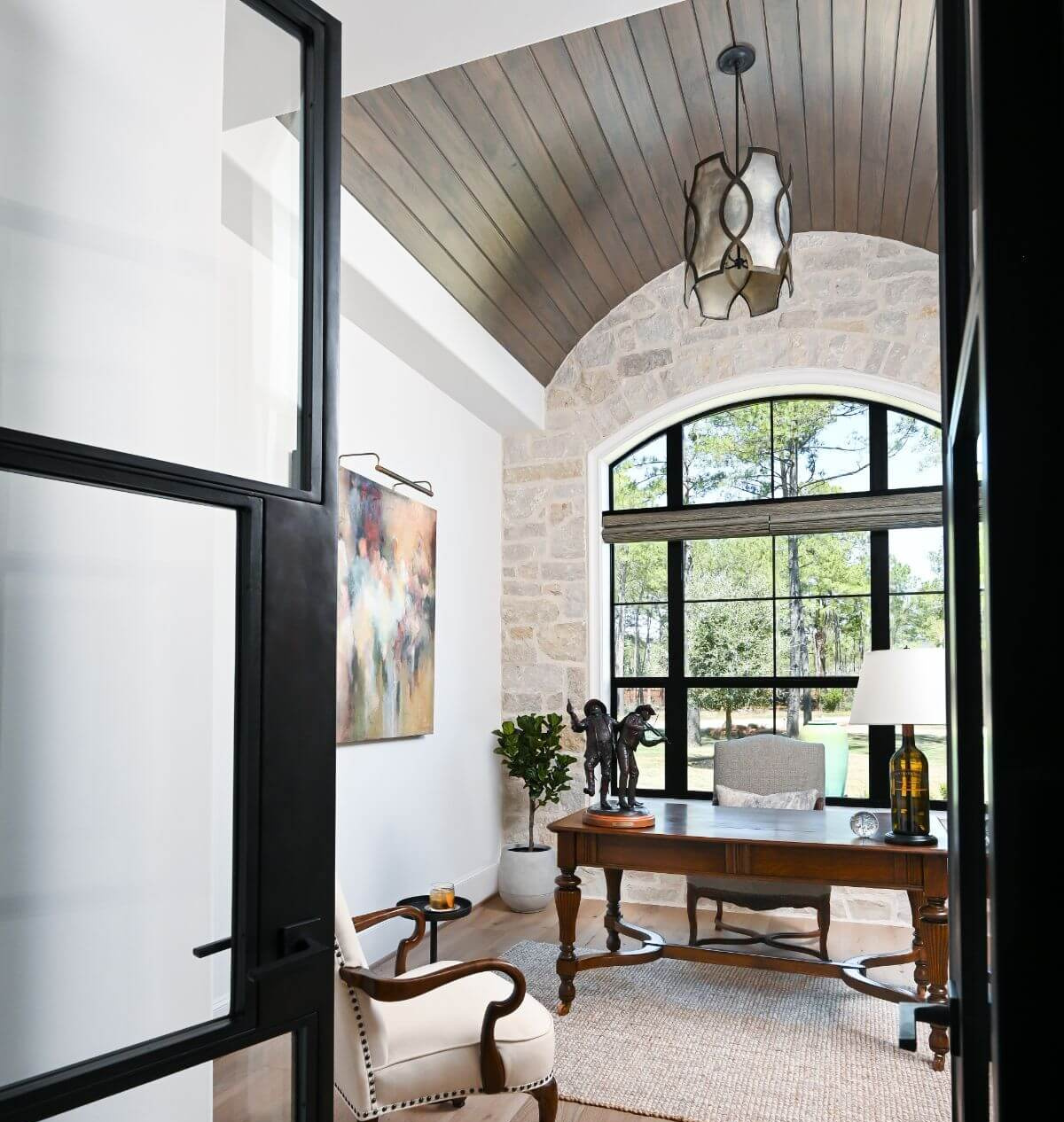 Beautiful steel doors to a modern French home office in a home by Morningstar Builders. #homeoffices #modernfrench