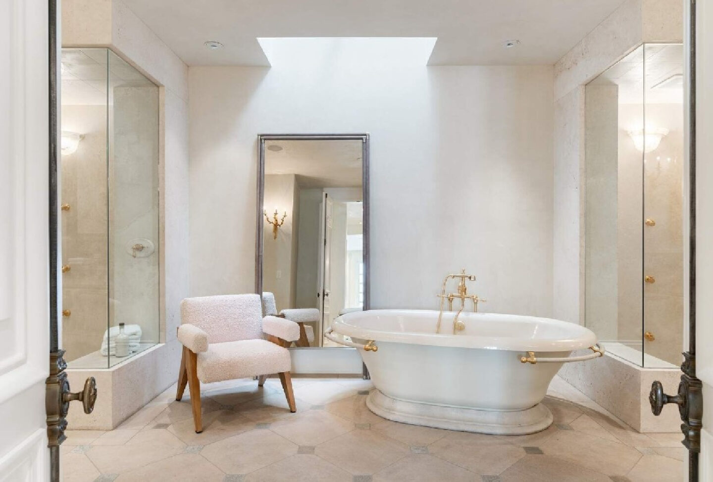 Elegant, understated, luxurious bathroom with soaking tub in a French Provincial mansion in San Francisco. #luxuriousbathroom #frenchbathroom #modernfrench