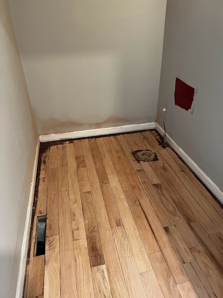 Powder room hardwood floor sanded for refinishing during Georgian renovation