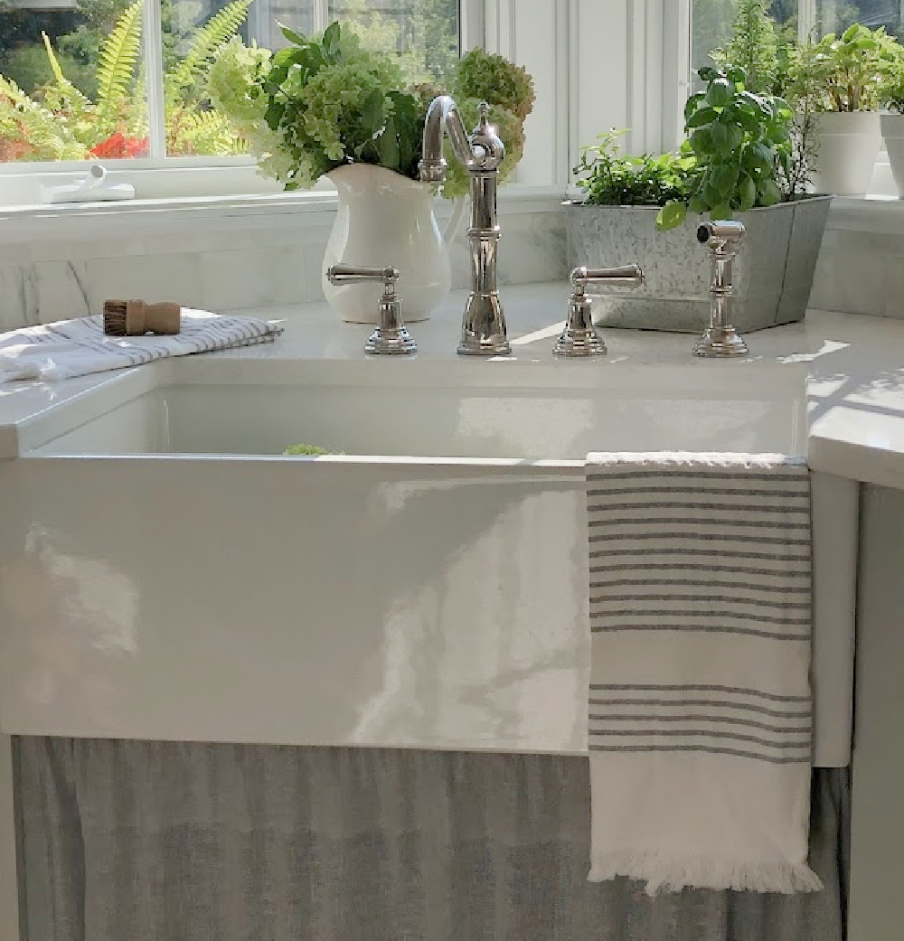 Hello Lovely's farm sink (Hyannis-30 from Nantucket Sinks) in renovated kitchen with Viatera Muse counters and Waterworks Julia faucet. #farmsinks #farmhousesink