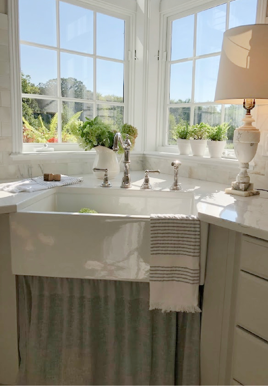 Hello Lovely's farm sink (Hyannis-30 from Nantucket Sinks) in renovated kitchen with Viatera Muse counters and Waterworks Julia faucet. #farmsinks #farmhousesink