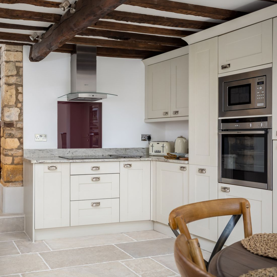 Kitchen with stone and beams in Abbots Cottage - a charming vacation rental in the Cotswolds. #cotswoldscottages