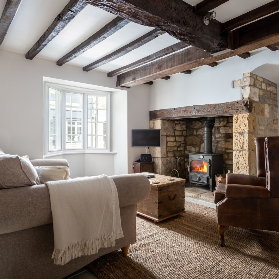Living room with fireplace in Abbots Cottage - a charming vacation rental in the Cotswolds. #cotswoldscottages
