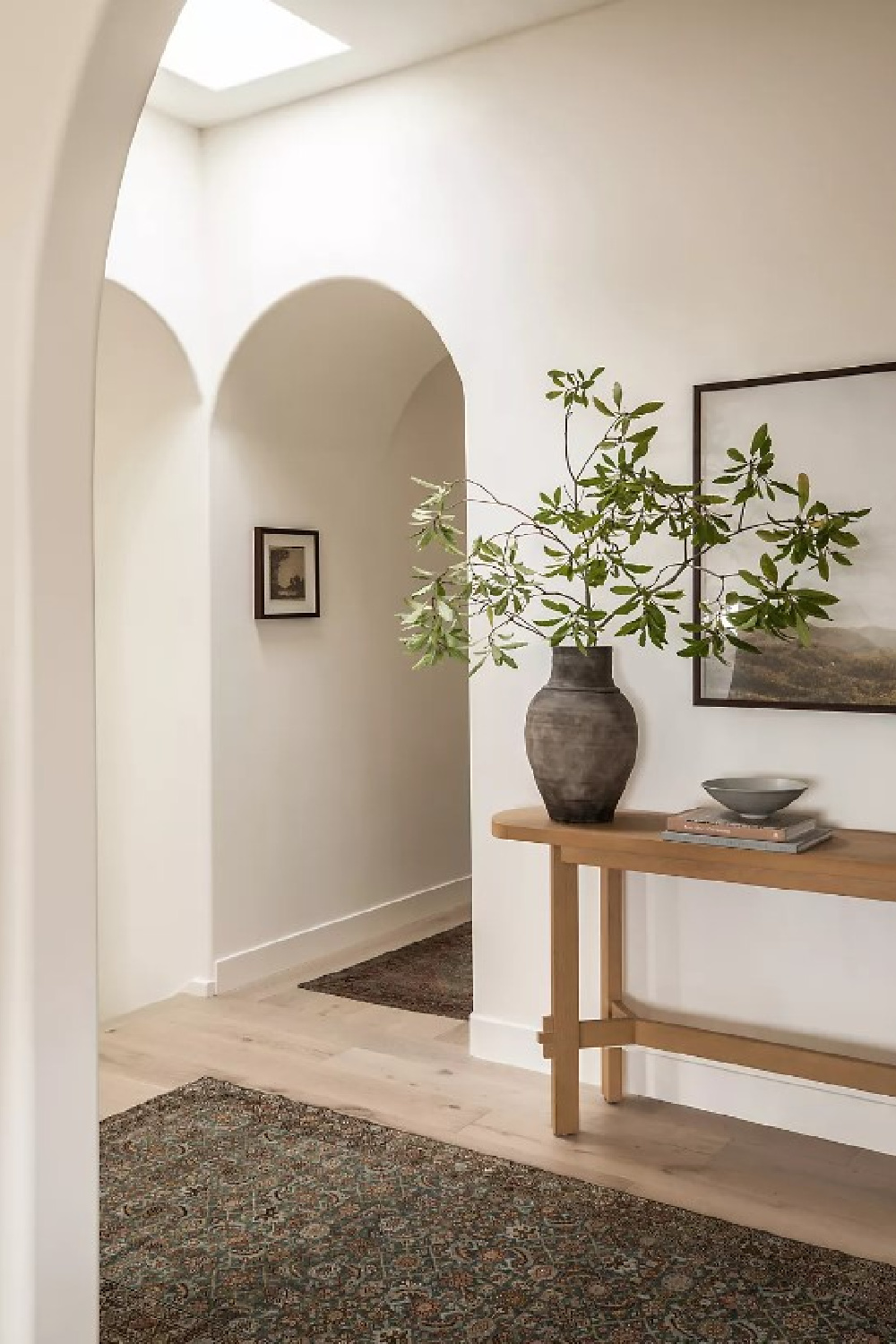 Beautiful entry with archways and Henderson console table - design by Amber Lewis. #henderson #consoletables
