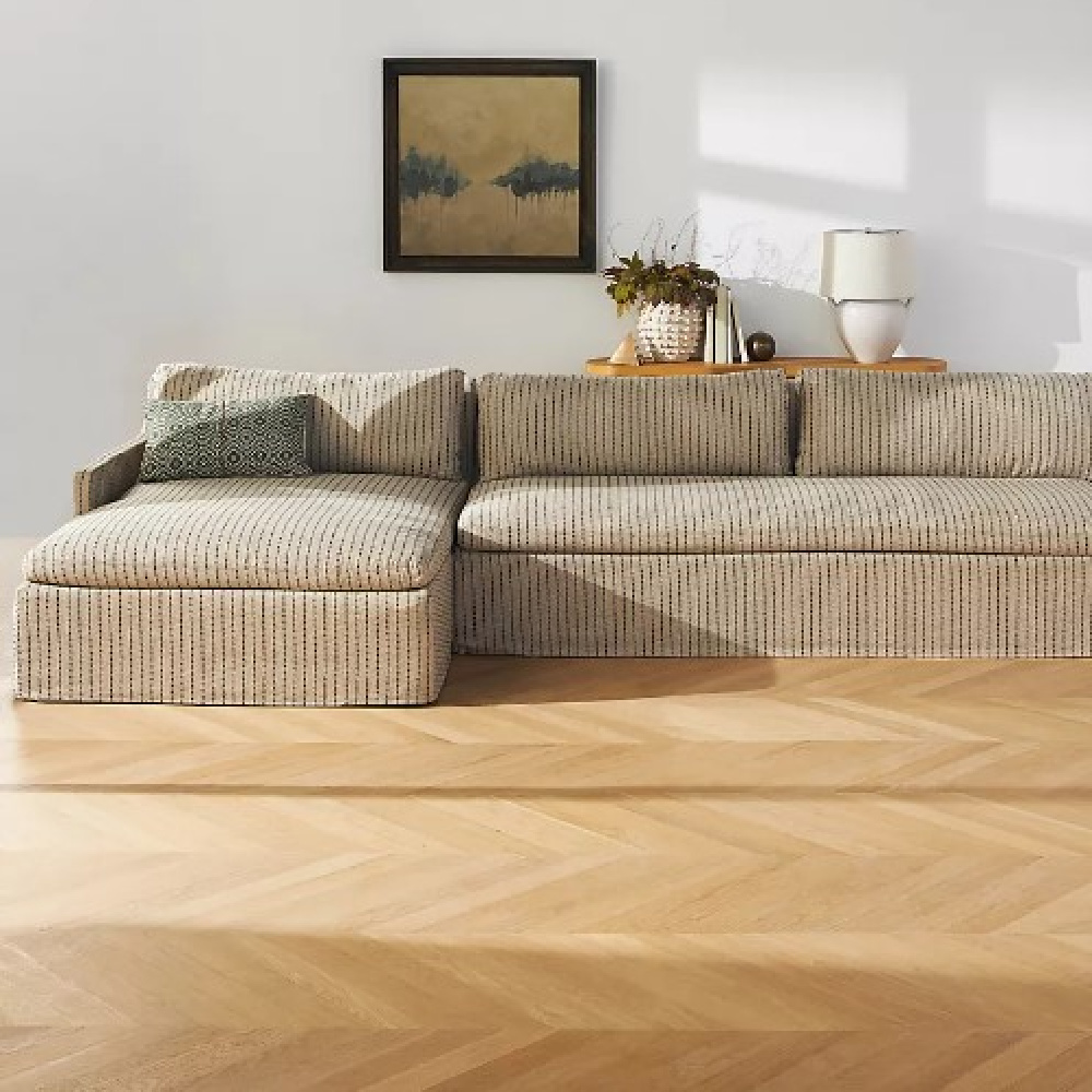 Slipcovered sectional sofa (Avant-garde Keane) designed by Amber Lewis. #sectionalsofas #slipcoveredfurniture