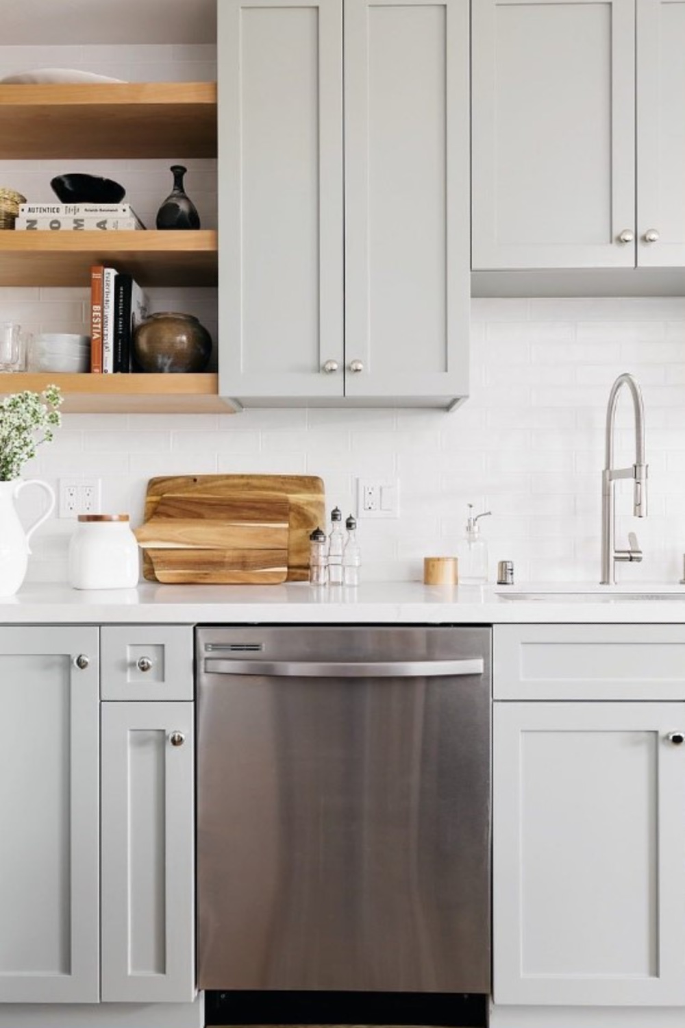 Benjamin Moore Fieldstone muted sage green paint color on kitchen cabinets - @caralinesierotainteriors. #benjaminmoorefieldstone #greenkitchencabinets