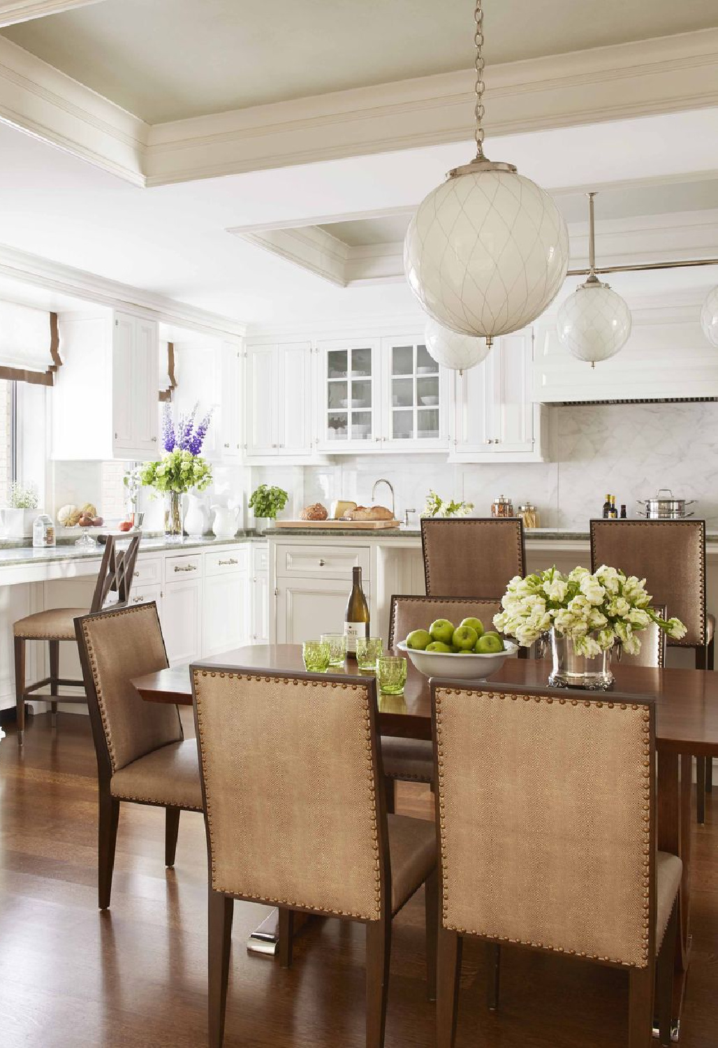 Ellie Cullman designed white kitchen with warm wood dining table and chairs - Veranda. #whitekitchens #kitchendesign