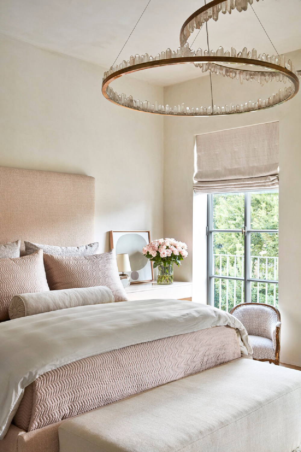 Luxuriously sumptuous modern French bedroom with velvet and linen pillows and ring chandelier by Christopher Boots. #modernfrench #bedrooms