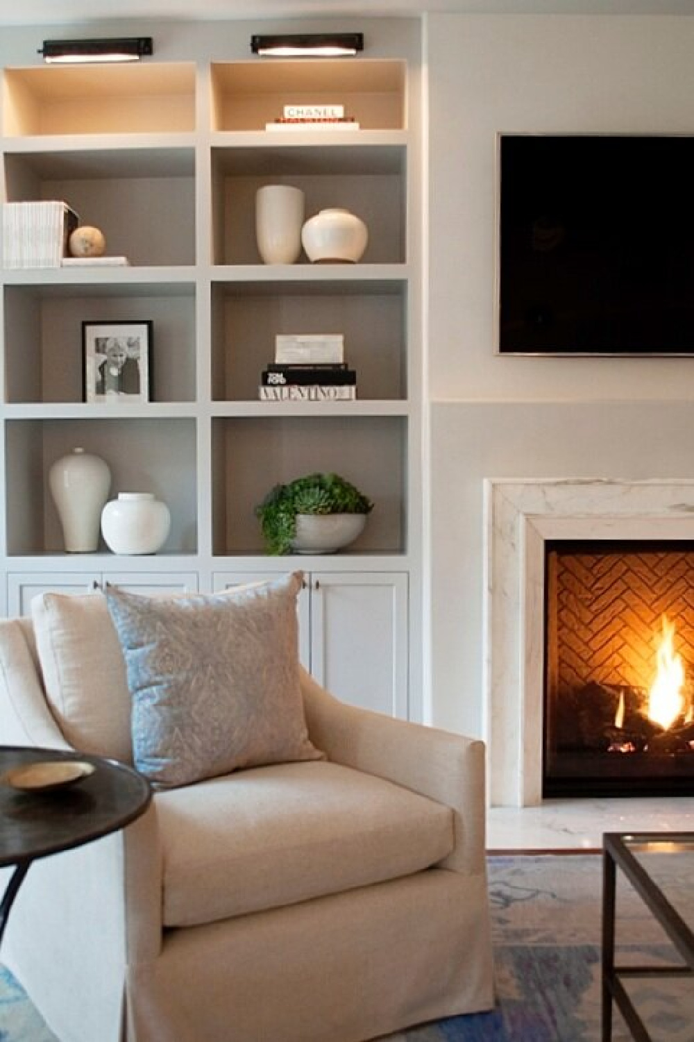 Jil Egan designed interior with built-ins and fireplace. #modernfrench