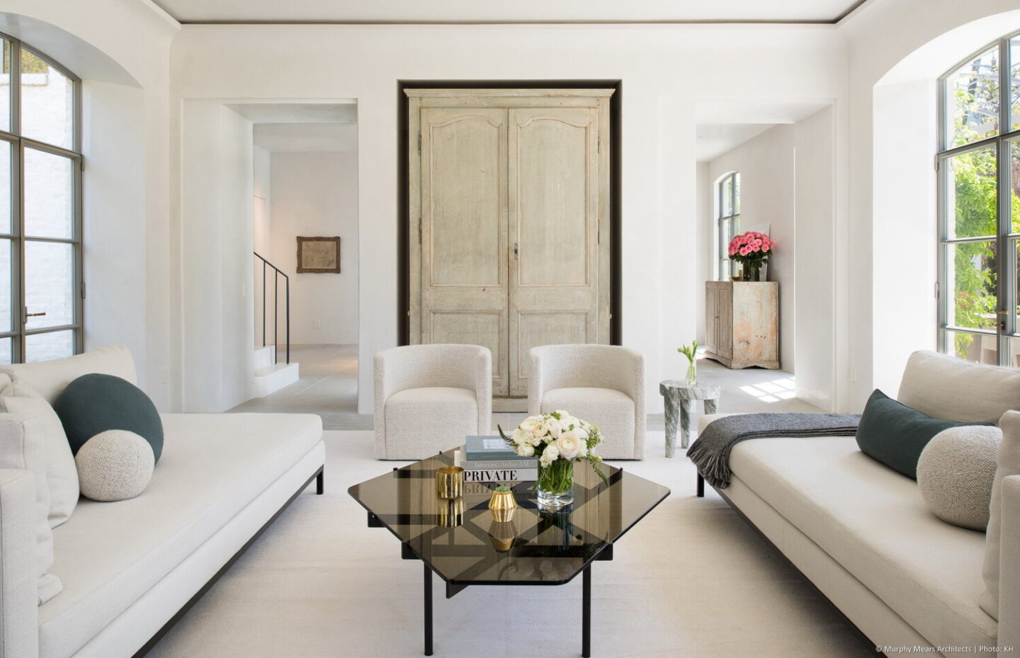 Modern French living room with elegant white mix of antiques - design by Jill Egan and architecture by Kirby Mears. #modernfrench #livingrooms