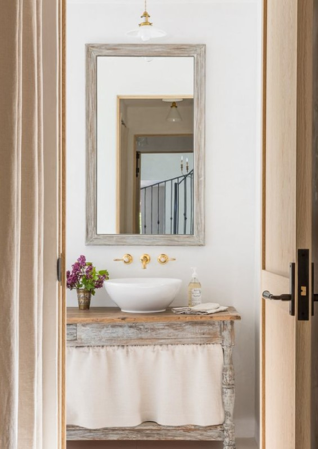 Giannetti Home designed Malibu bathroom with rustic elegance in Luxe Magazine.