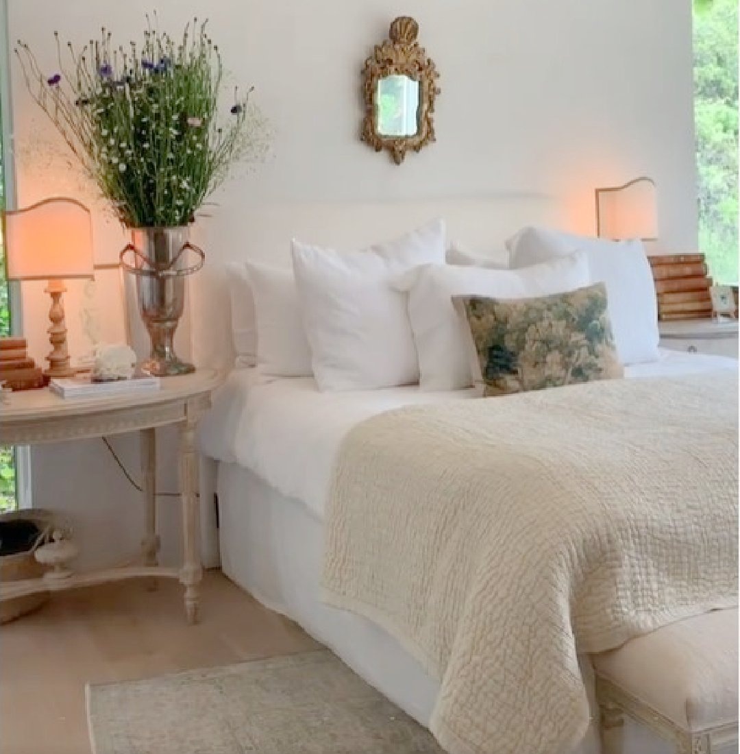 Serene modern French farmhouse bedroom at Patina Farm with white linen bedding, Swedish bedside tables, and design by Brooke Giannetti - Velvet and Linen. #patinafarm #modernfrenchbedroom