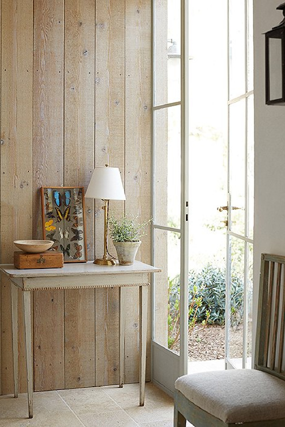 Rustic wood paneled wall and steel doors - Patina Farm (Brooke Giannetti) European country farmhouse in Ojai. #patinafarm #rusticelegance