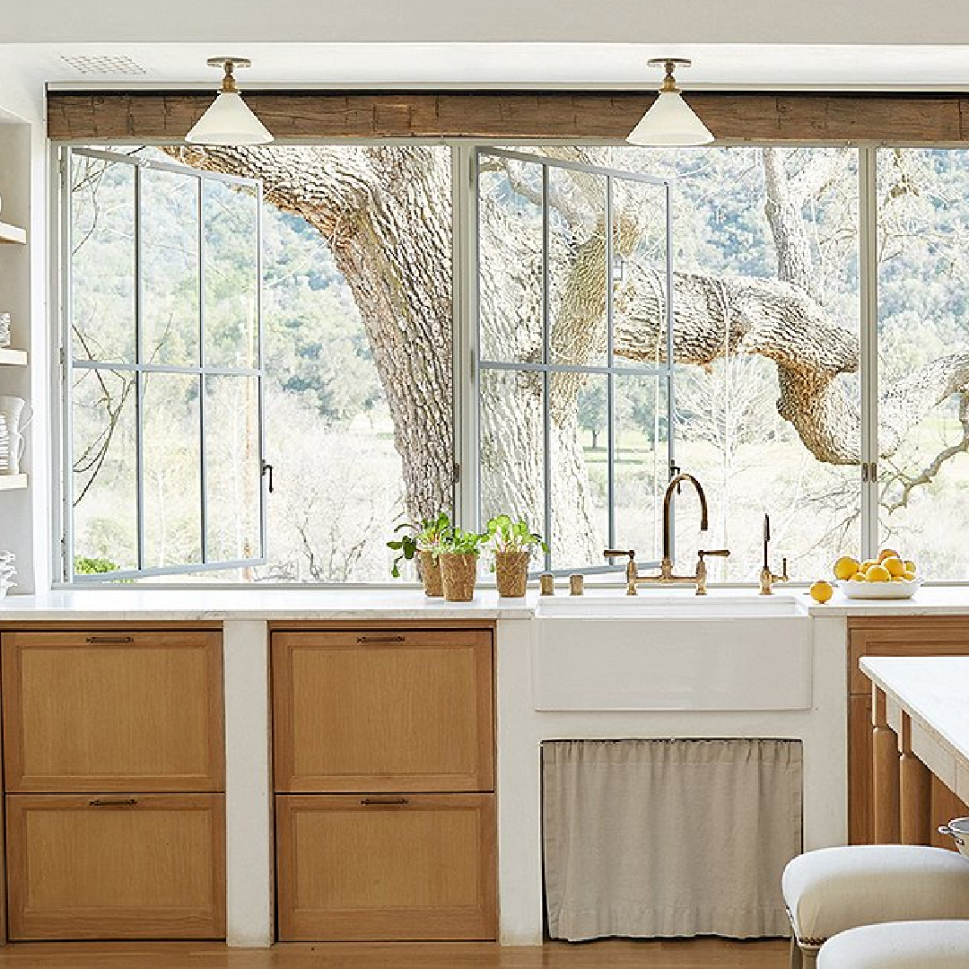 Steel windows, white oak cabinets, skirted farm sink in kitchen - Patina Farm (Brooke Giannetti) European country farmhouse in Ojai. #patinafarm #vintagemodern #modernrustic #frenchkitchens