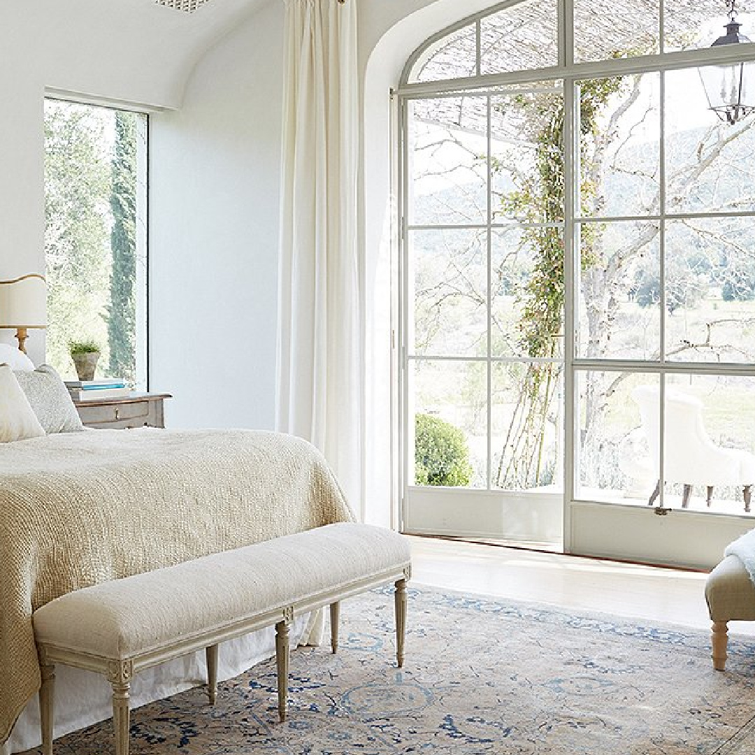 Glass and steel doors in bedroom - Patina Farm (Brooke Giannetti) European country farmhouse in Ojai. #patinafarm #vintagemodern #modernrustic #steelwindows