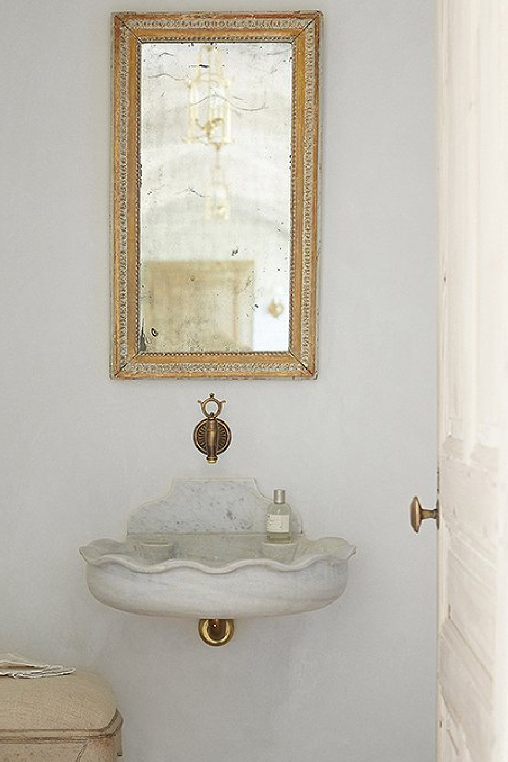 Stone sink and unlaquered brass in powder room - Patina Farm (Brooke Giannetti) European country farmhouse in Ojai. #patinafarm #vintagemodern #modernrustic #stonesink