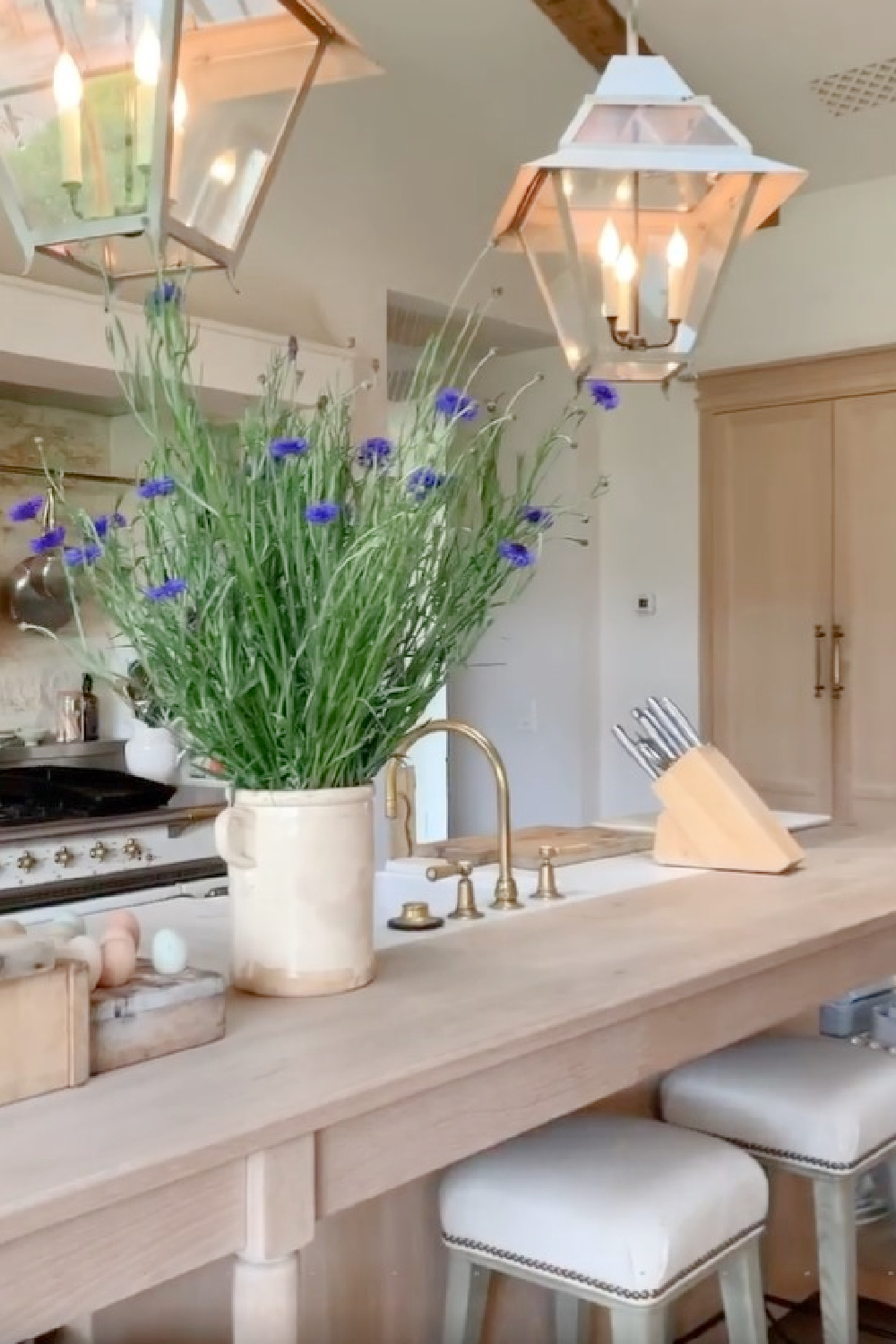 Patina Farm French farmhouse style kitchen with white oak, Lacanche range, limestone, and bespoke design by Giannetti Home. #patinafarm #frenchfarmhousekitchen