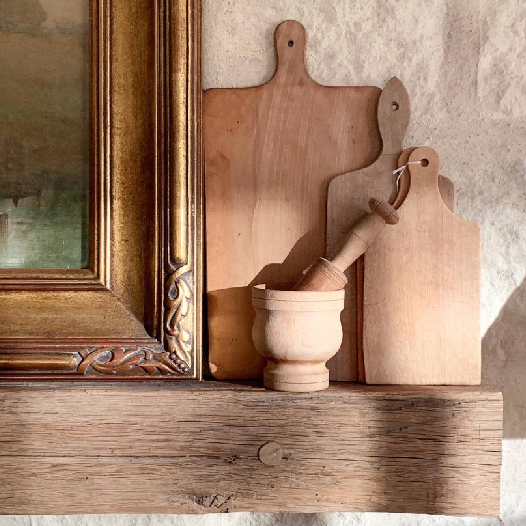 Vintage bread boards on a rustic mantel at Patina Farm - Velvet and Linen photo. #frenchfarmhouse #rusticdecor