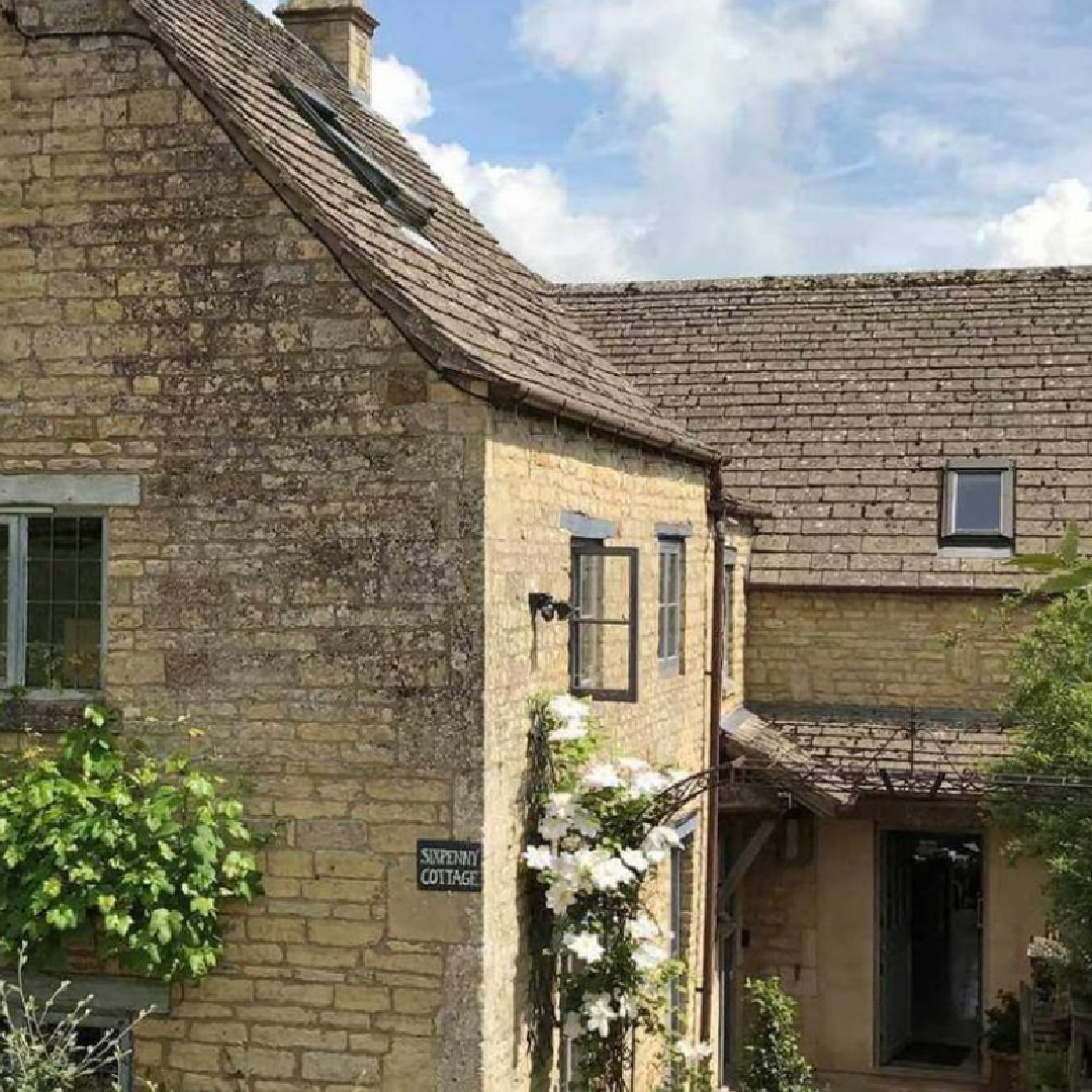 Rustic stone exterior of Sixpeny Cottage - a charming vacation rental in the Cotswolds.