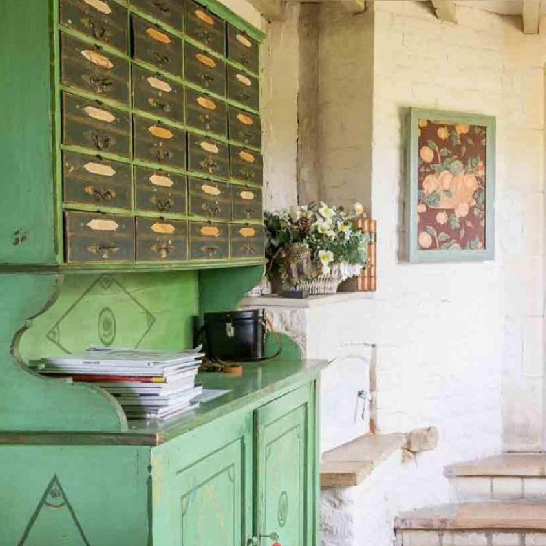 Charming entrance with green cupboard in Sixpenny Cottage - a vacation rental in the Cotswolds.