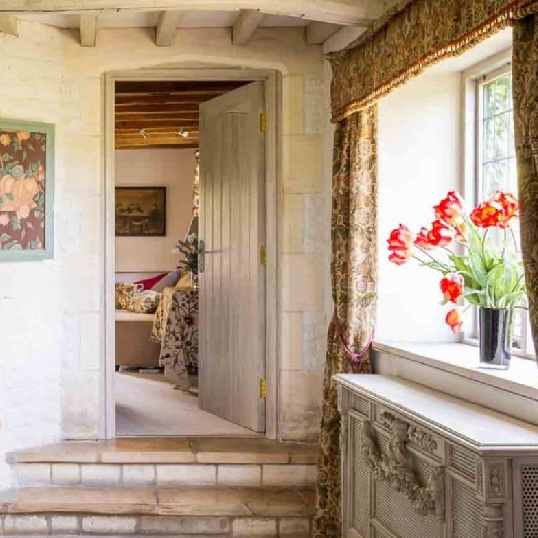 Charming entrance with green cupboard in Sixpenny Cottage - a vacation rental in the Cotswolds.