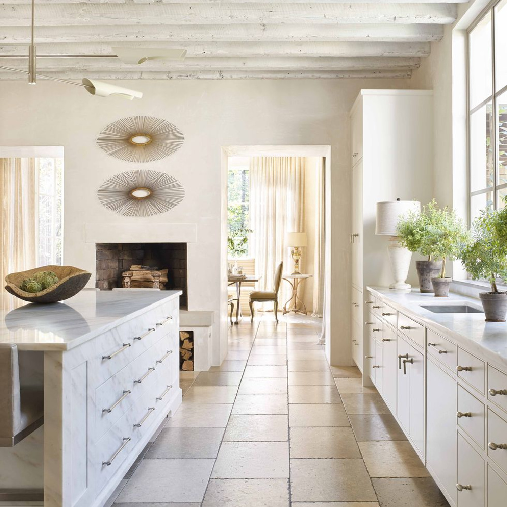 White modern French kitchen by Carolyn Malone and D. Stanley Dixon - limestone floors and Imperial Danby marble. #modernfrench #frenchkitchens