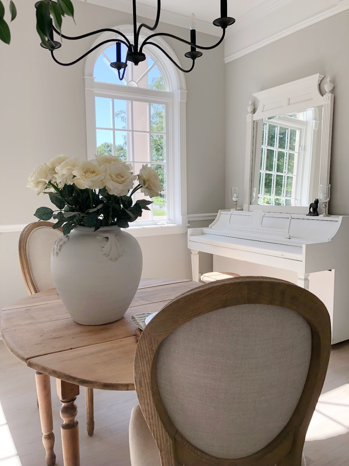 Hello Lovely's entry and dining room with tree mural wallpaper and light oak floors. #reposegray #treemural