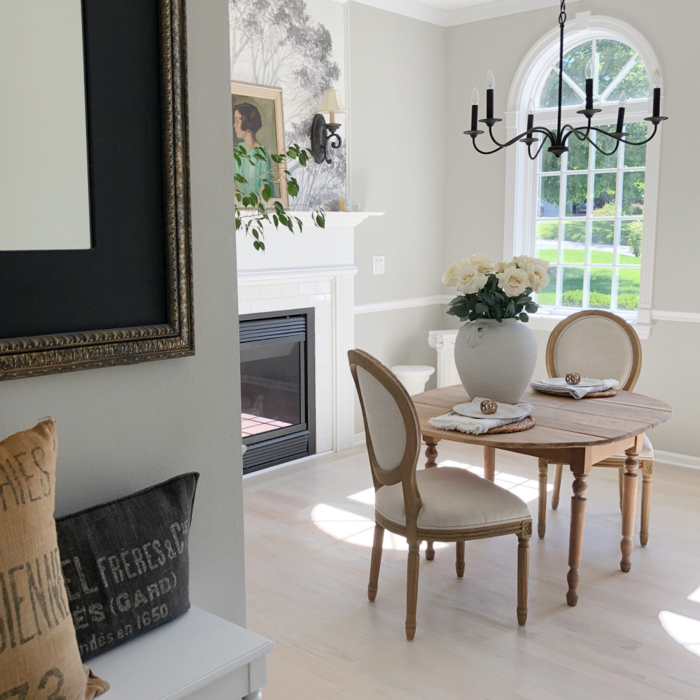 Hello Lovely's entry and dining room with tree mural wallpaper and light oak floors. #diningrooms #treemural