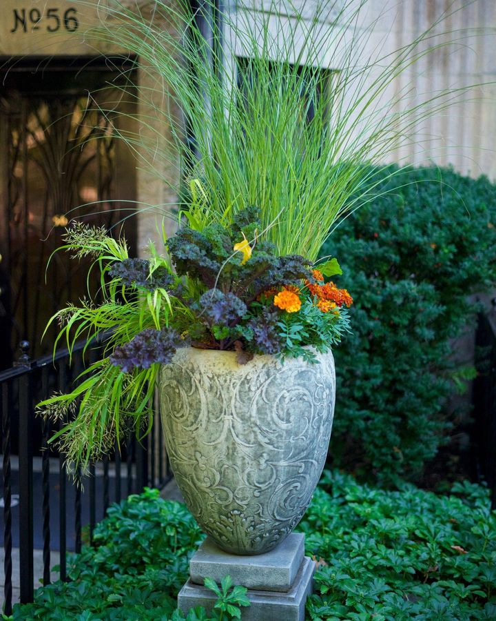 Beautiful fall planter - @privatenewport. #elegantplanters #fallplanters