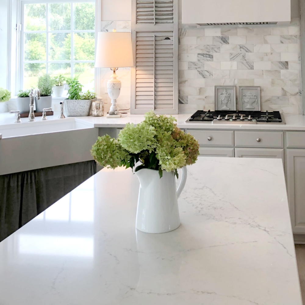 Progress on our kitchen renovation where we added Viatera Muse quartz and calacatta gold marble subway tile.