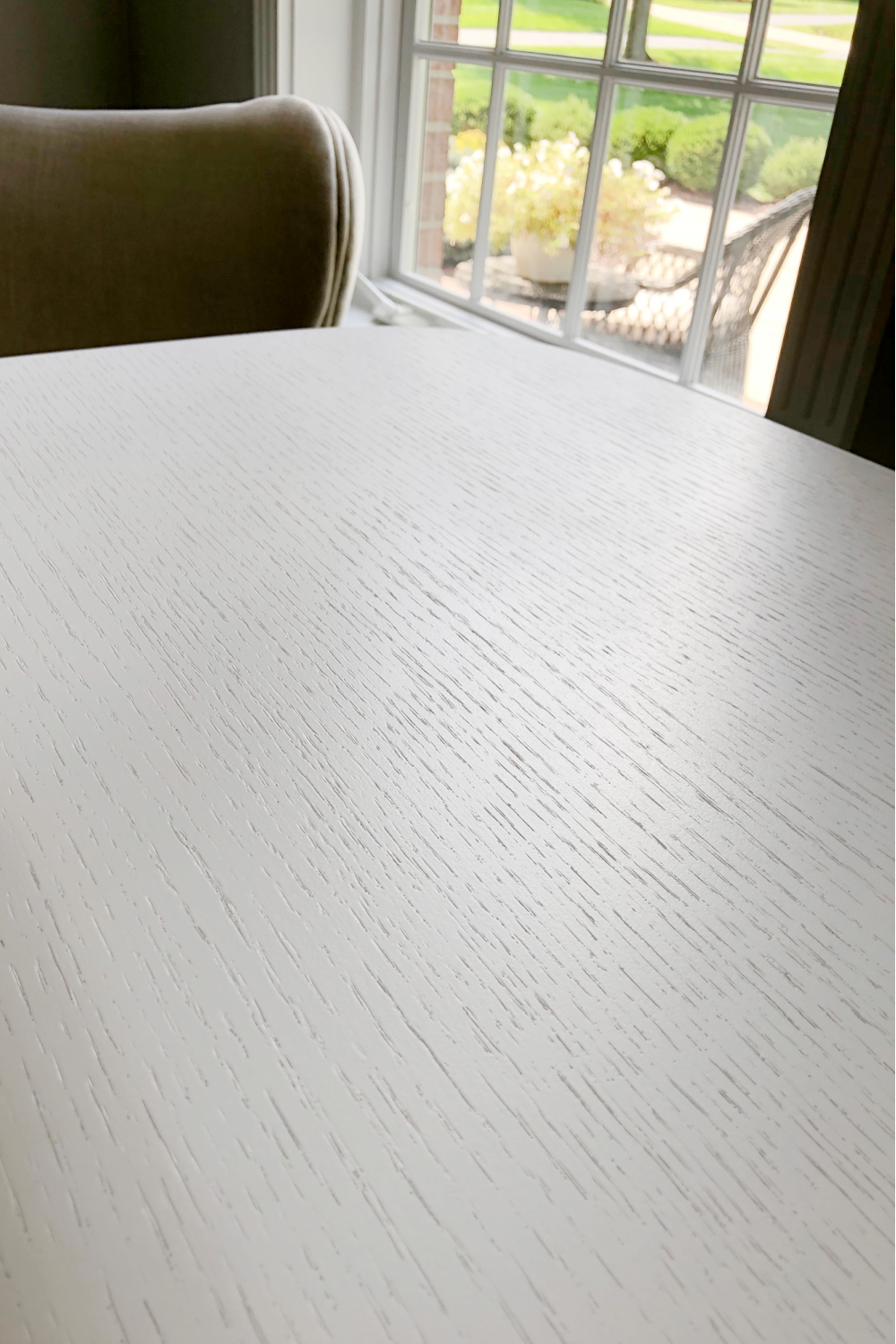 Detail of white on oak desk top of BDi''s Soma Lift Desk - Hello Lovely Studio.