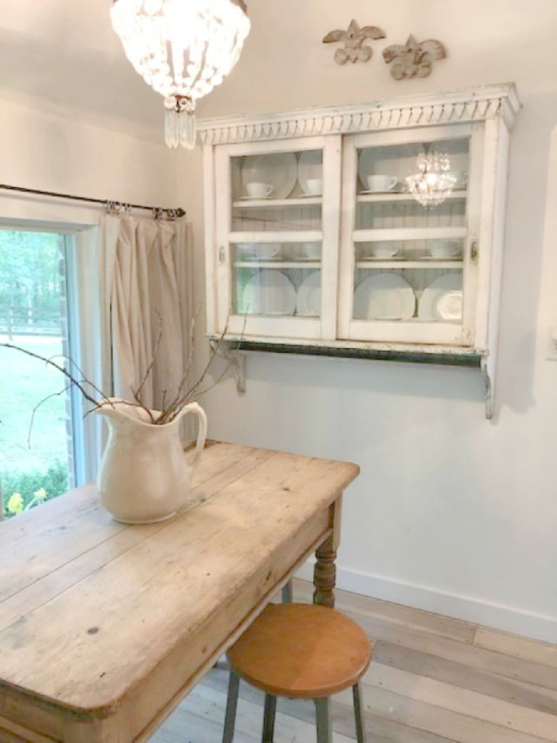 Rustic farm table in kitchen of country cottage in Leiper's Fork, TN known as storybook cottage - Hello Lovely Studio.