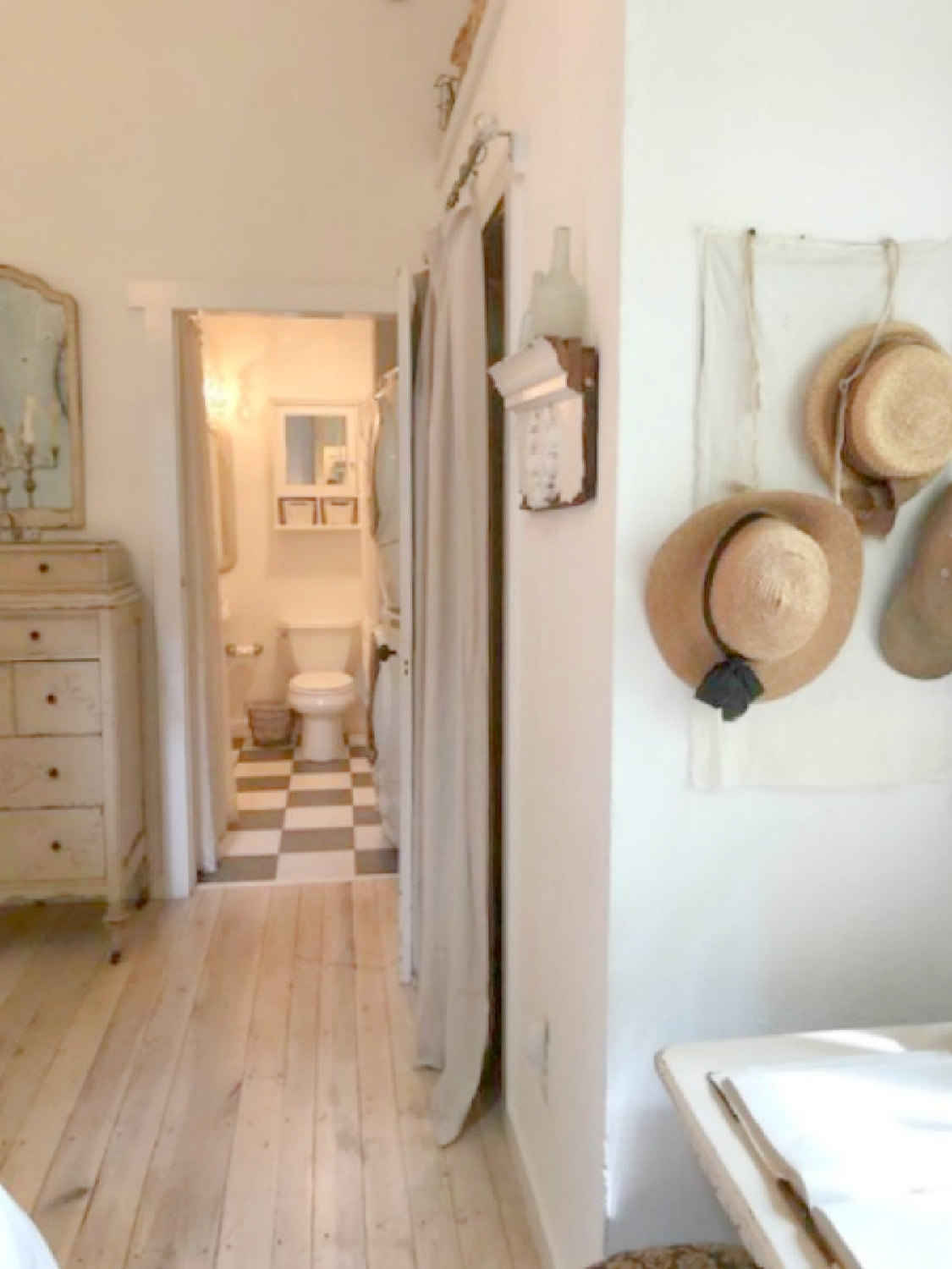 Charming bedroom with vintage dresser in rustic country cottage in Leiper's Fork, TN known as storybook cottage - Hello Lovely Studio.