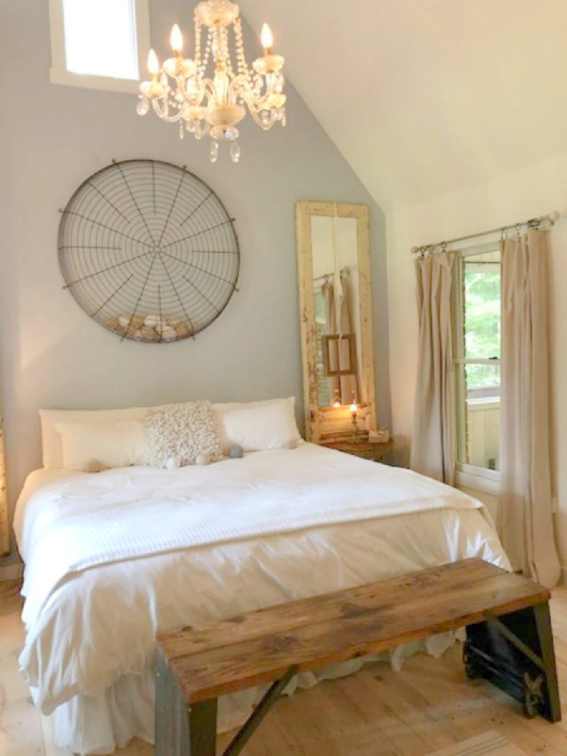 Bedroom with vintage furniture and decor in rustic country cottage in Leiper's Fork, TN known as storybook cottage - Hello Lovely Studio.