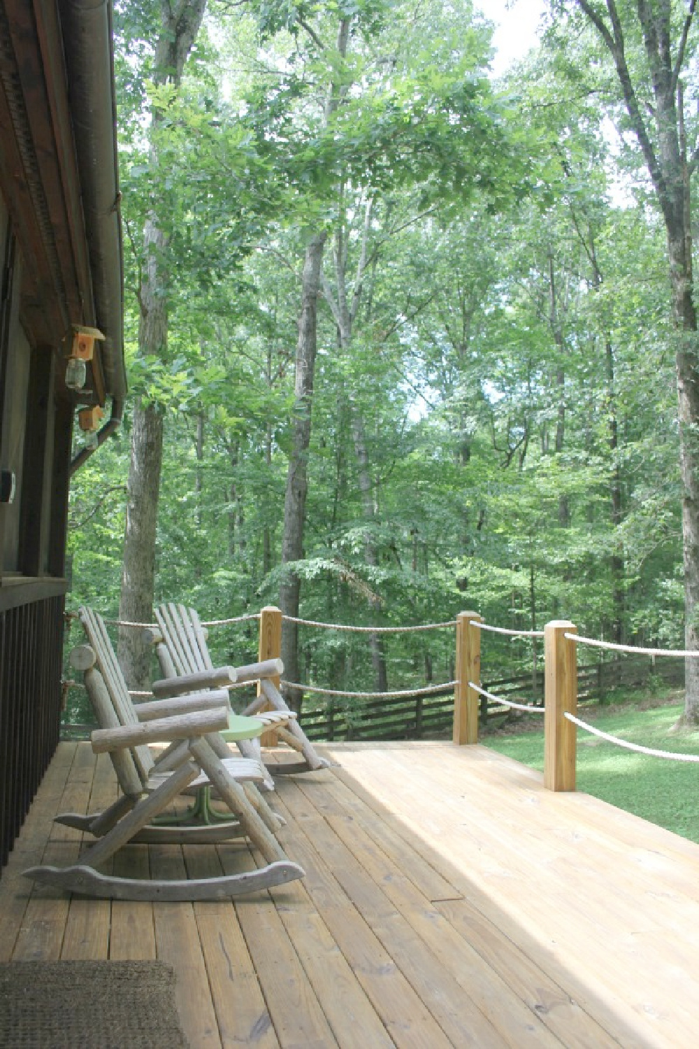 Back porch at rustic country cottage in Leiper's Fork, TN known as storybook cottage - Hello Lovely Studio.