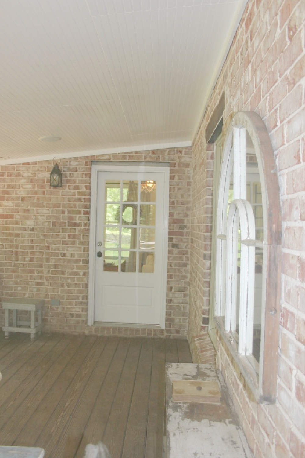 Brick screen porch at rustic country cottage in Leiper's Fork, TN known as storybook cottage - Hello Lovely Studio.