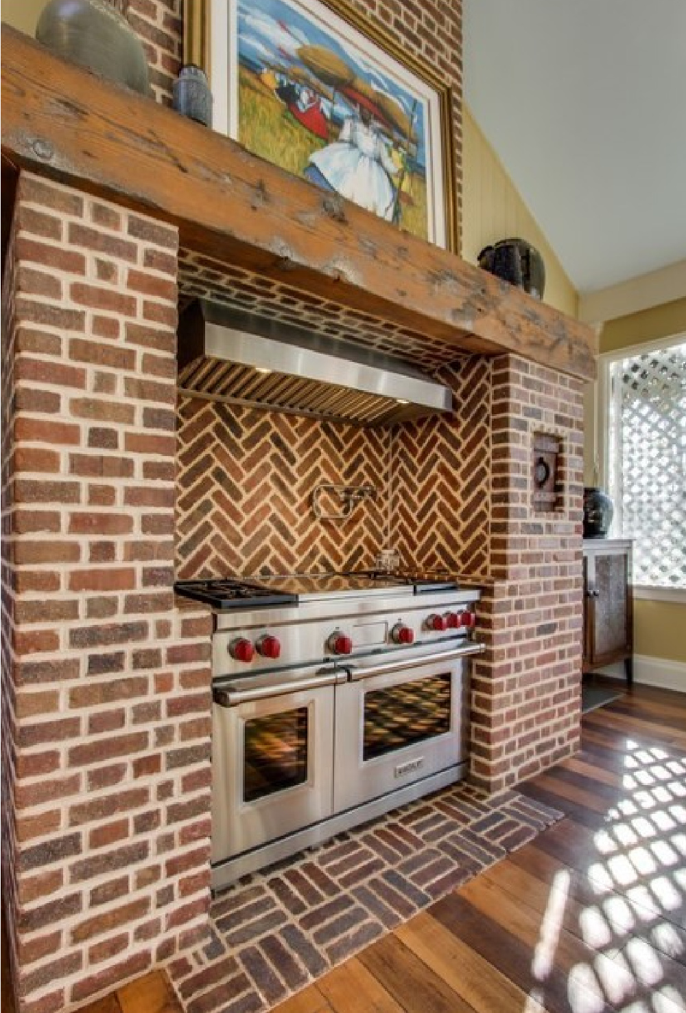 Range and red brick in restored kitchen - 3200 Del Rio Pike in Franklin - Meeting of the Waters house. #historichomes #franklintn