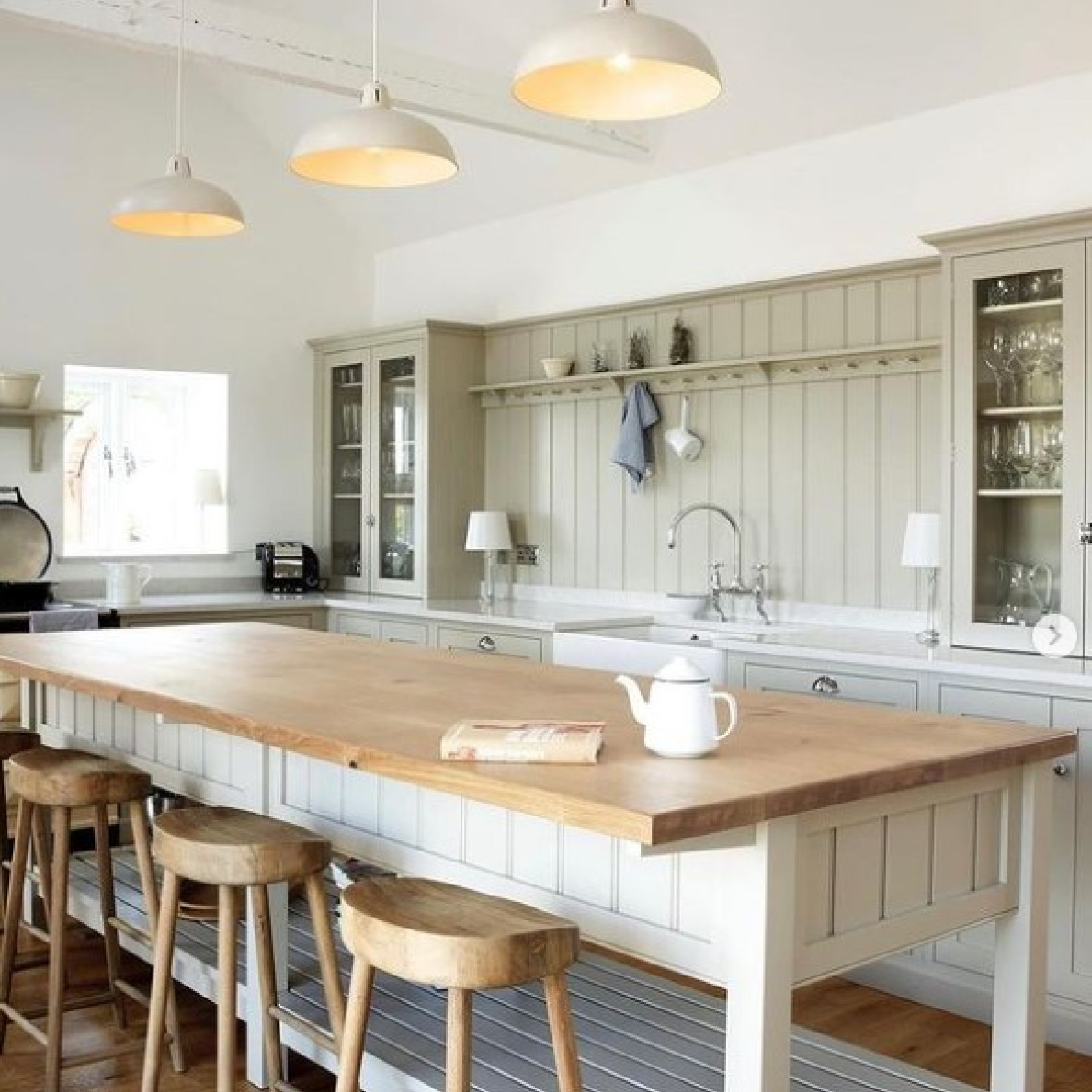 Beautiful English country bespoke kitchen by deVOL with Shaker style peg rack and wood top on island work table. #devolkitchens #englishcountrykitchen #bespokedesign