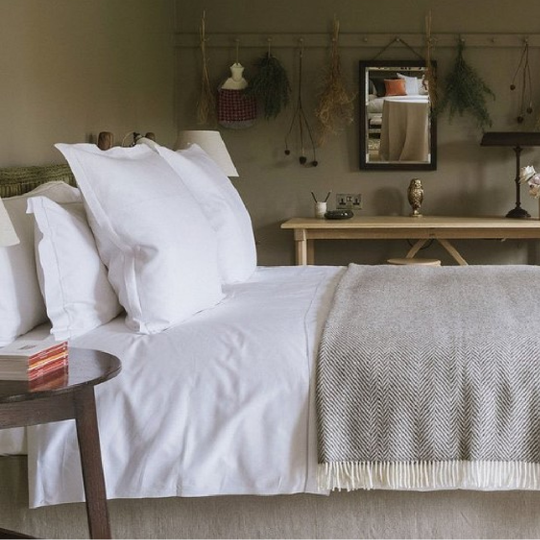 Beautiful English country classic bedroom with moody green walls at Heckfield Place. #englishcountrybedroom #europeancountry