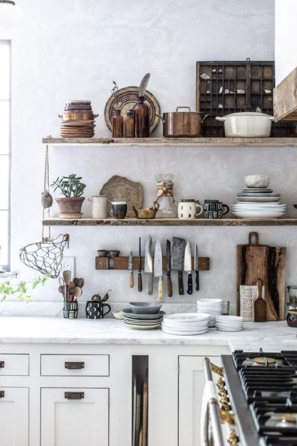 Beautifully rustic yet serene kitchen with neutral tones and marble counters - @bethkirby. #rustickitchen #floatingshelves