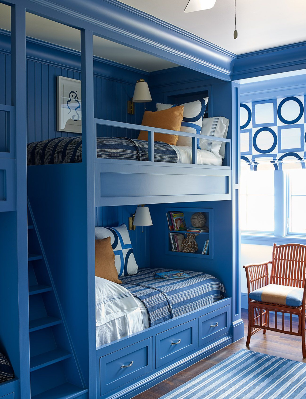 Bold blue bunk room designed by Suzanne Kasler in The Bunk Bed Book (Gibbs Smith, 2022) by Laura Fenton. #bunkbeds