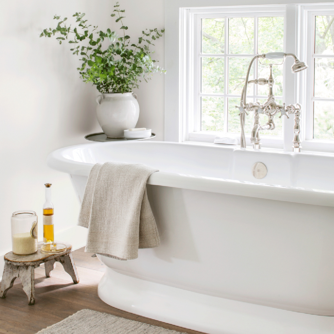 Soaking tub in Nancy Fishelson's renovated historic home in Killingworth - Country Living magazine/Helen Norman/Janna Lufkin.