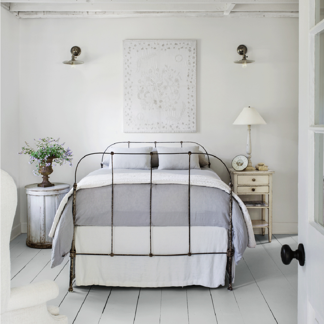 Country bedroom in Nancy Fishelson's renovated historic home in Killingworth - Country Living magazine/Helen Norman/Janna Lufkin.
