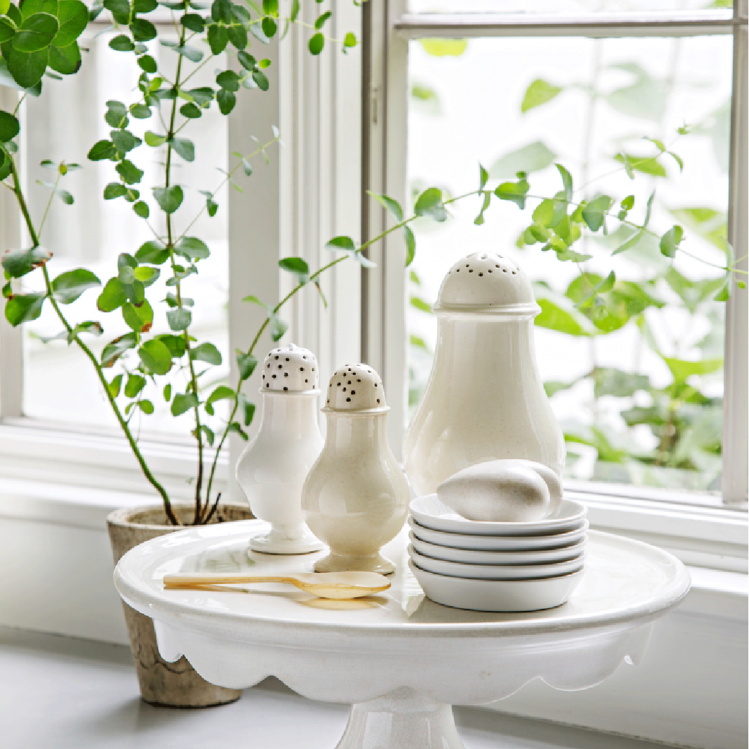 White accessories in the kitchen of Nancy Fishelson's renovated historic home in Killingworth - Country Living magazine/Helen Norman/Janna Lufkin.