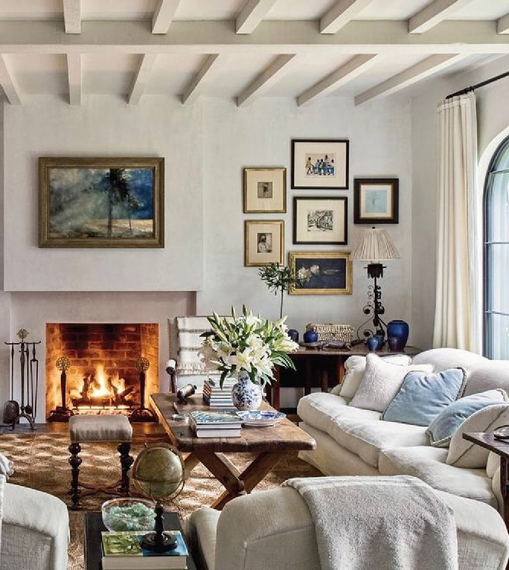 Living room by Jackye Lanham is accented with antiques from Robuck and altar stick lamp - in Milieu magazine, Fall 2022. 