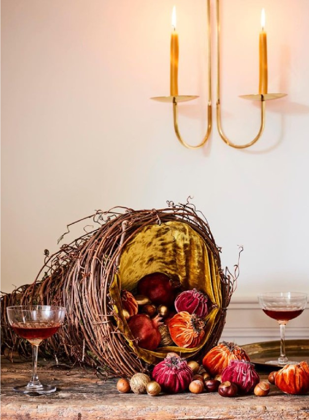 Pomegranate cornucopia centerpiece at Thanksgiving table - Martha Stewart. #cornucopia #fallcenterpiece #thanksgivingcenterpiece